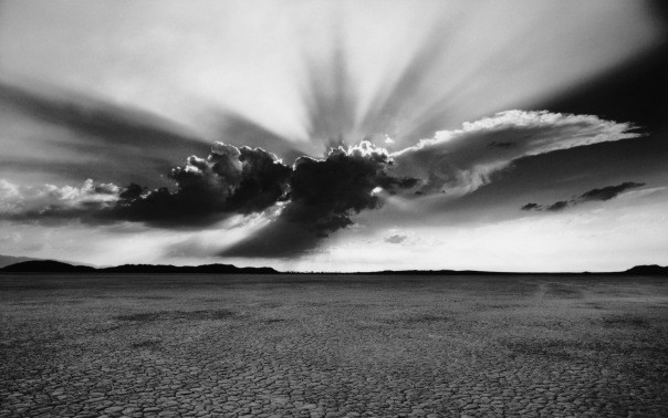 black and white photograph of horizon with row of clouds from desktop pictures files